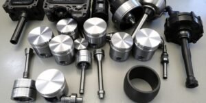 engine pistons and related components,